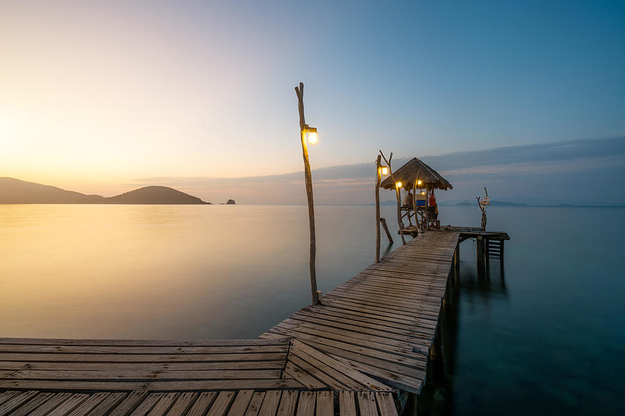 Sunset Photograph - Wooden Bar In Sea And Hut With Clear #1 by Prasit Rodphan