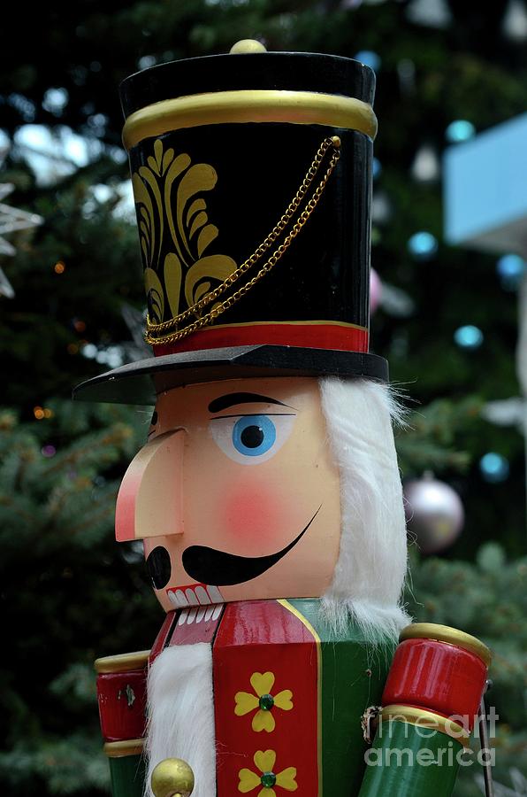 Wooden Nutcracker statue in colorful regalia from Christmas fairy tale story  #1 Photograph by Imran Ahmed