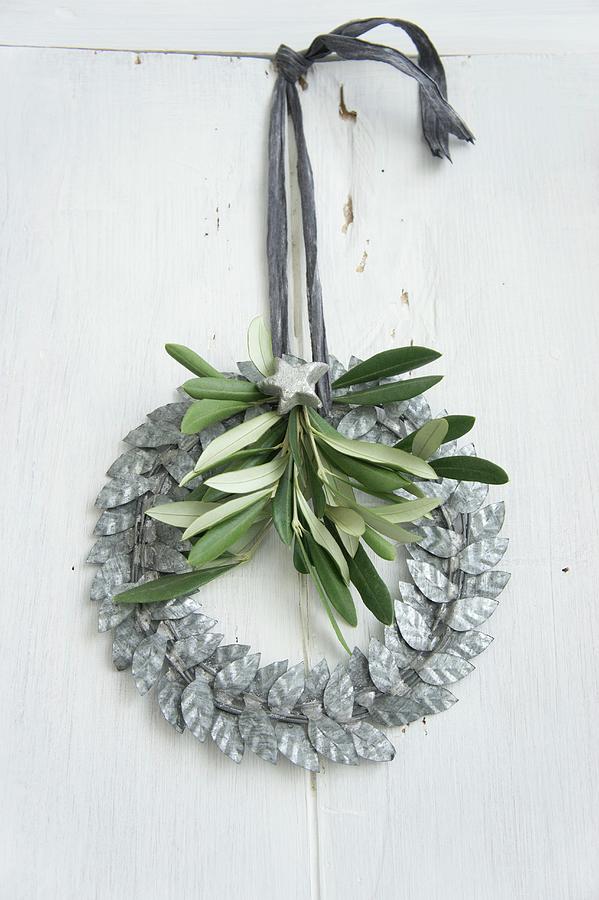 Wreath Of Silver-grey Metal Leaves Decorated With Olive Sprig #1 Photograph by Martina Schindler