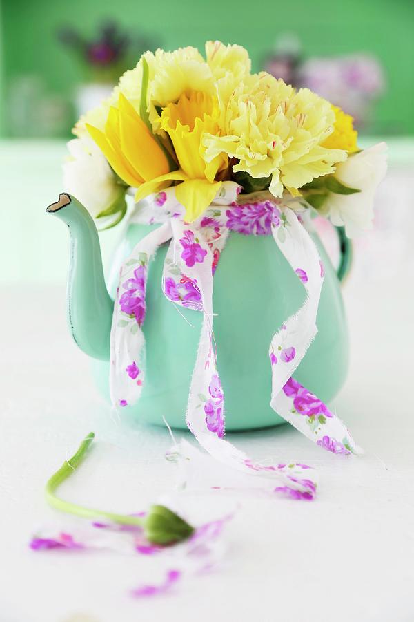 Yellow Spring Posy Of Tulips, Carnations And Narcissus In Turquoise Teapot #1 Photograph by Syl Loves