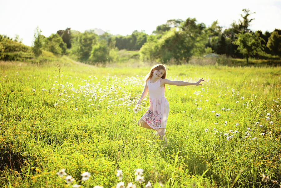 Young Girl With Red Hair In Pink Dress Skipping Through Meadow ...