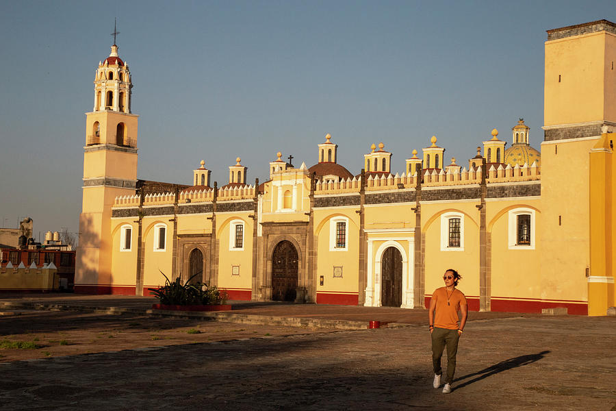 Mexico Photograph - Young Mexican Man Walking In Front Of Yellow Church In Cholula, Puebla by Cavan Images Mexico Photograph - Young Mexican Man Walking In Front Of Yellow Church In Cholula, Puebla by Cavan Images