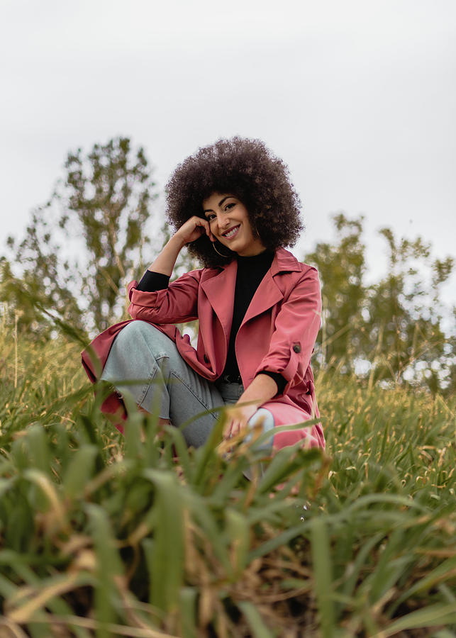 Music Photograph - Young Mixed Woman With Afro Hairstyle In The Park. #1 by Cavan Images