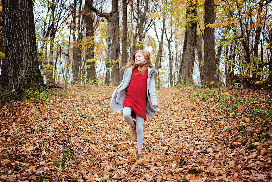 Fall Photograph - Young Red Hair Girl Playing Outside In Fall Leaves #1 by Cavan Images