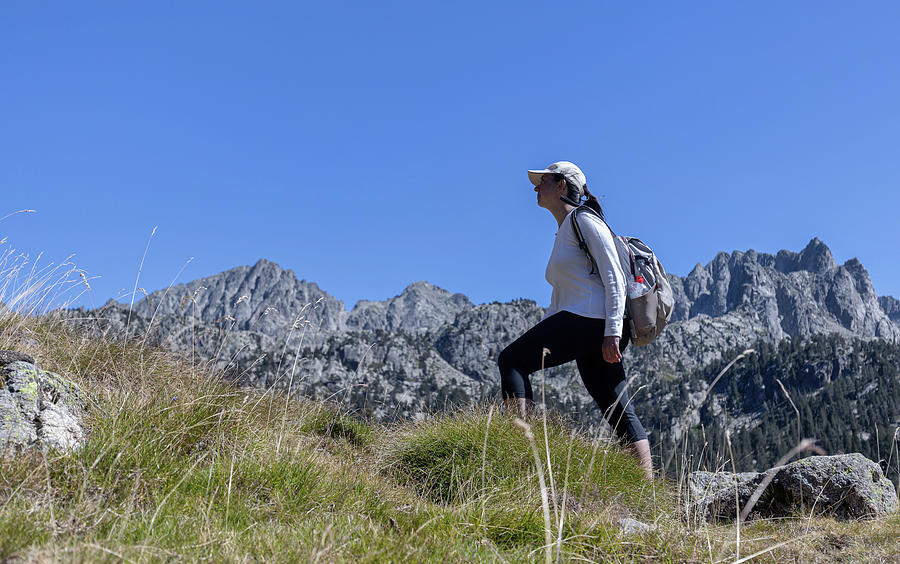 Sporty Photograph - Young Tourist Woman Walking On The Spanish Pyrenees Mountain #1 by Cavan Images