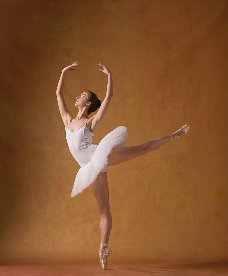 Young Woman Performing Ballet Pose #1 Photograph by Pm Images