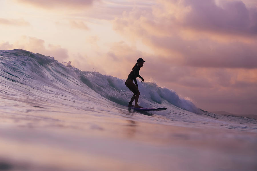 Young Woman Surfing At Sunset Photograph by Cavan Images - Fine Art America