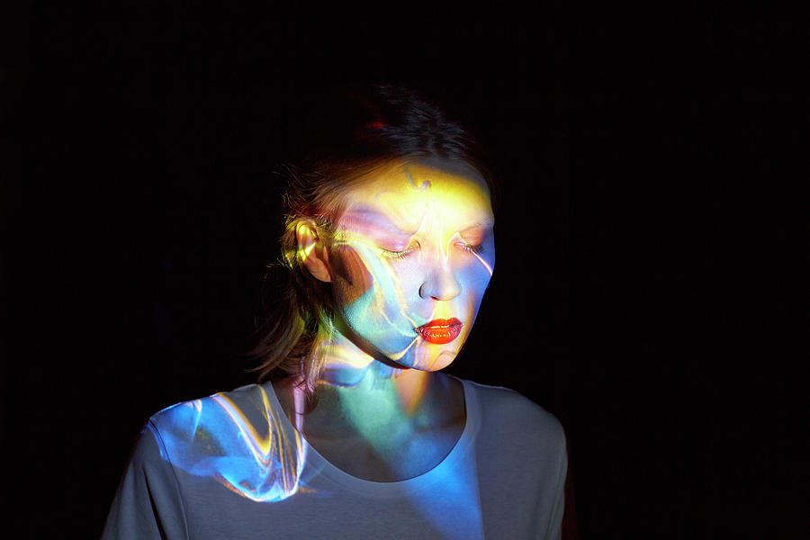 Young Woman With Multicolored Light In #1 Photograph by Mads Perch