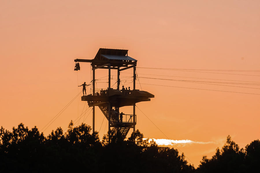 Zipline Tower With People Silhouettes At Sunset #1 Photograph by Alex Grichenko