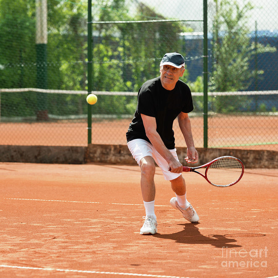 Active Senior Man Playing Tennis #10 Photograph by Microgen Images/science Photo Library