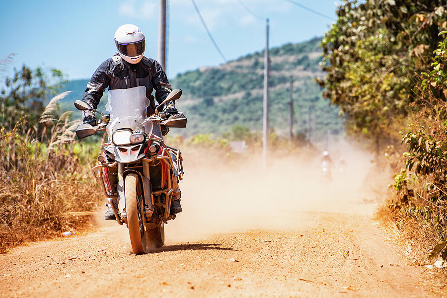 Rural Scene Photograph - Man Riding His Adventure Motorbike On Dusty Road In Cambodia #10 by Cavan Images