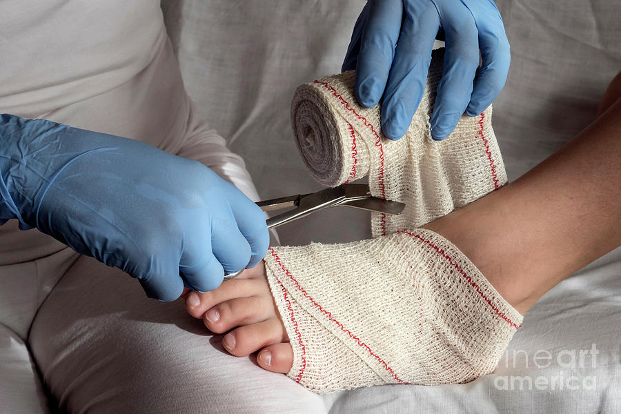 Nurse Tying Bandage On Patients Foot #10 Photograph by Digicomphoto/science Photo Library