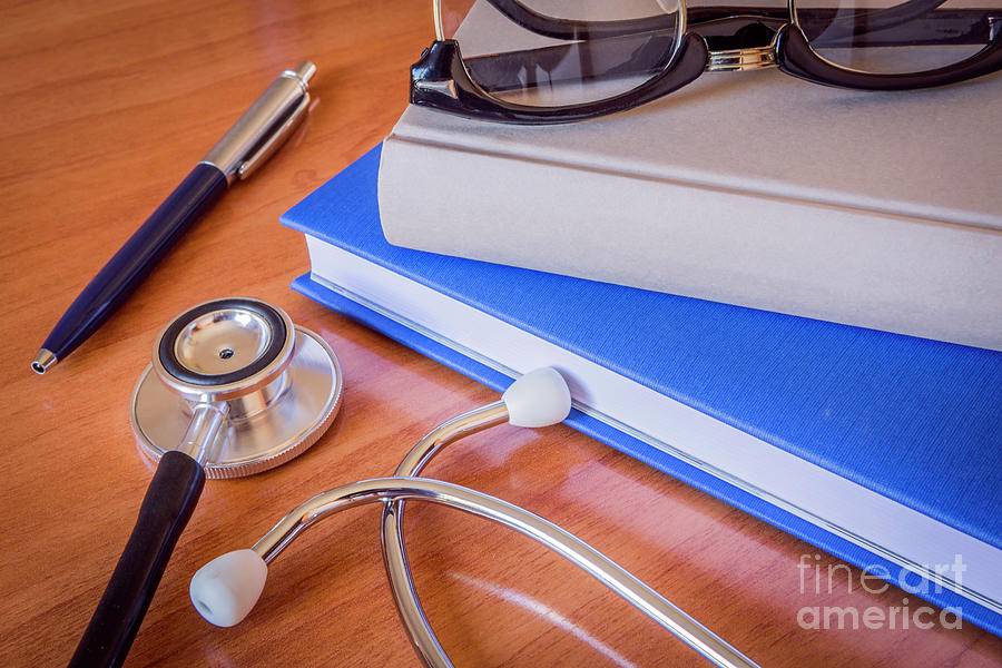 Stethoscope Next To A Book #10 Photograph by Digicomphoto/science Photo Library