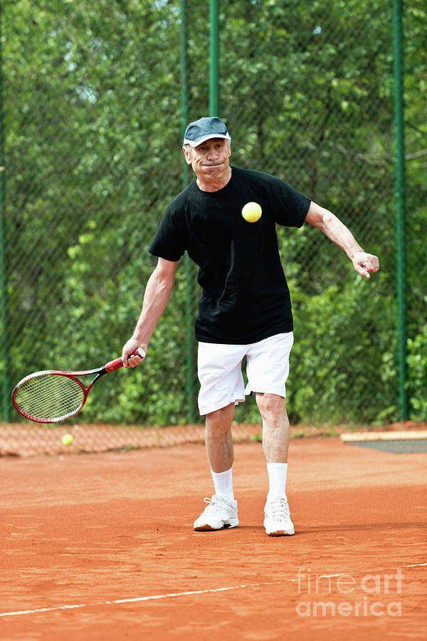 Active Senior Man Playing Tennis #11 Photograph by Microgen Images/science Photo Library