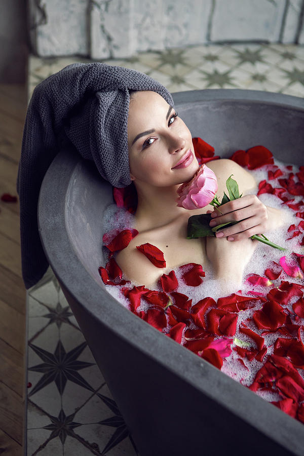 Beautiful Girl Lying In A Stone Bath With Rose Petals And Foam #1 by Elena  Saulich