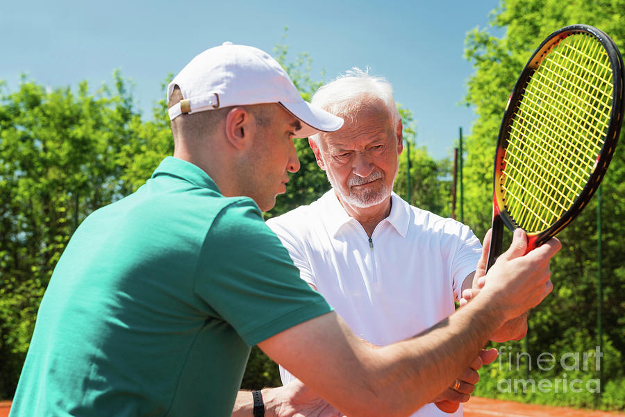 Senior Man With Tennis Instructor #11 Photograph by Microgen Images/science Photo Library