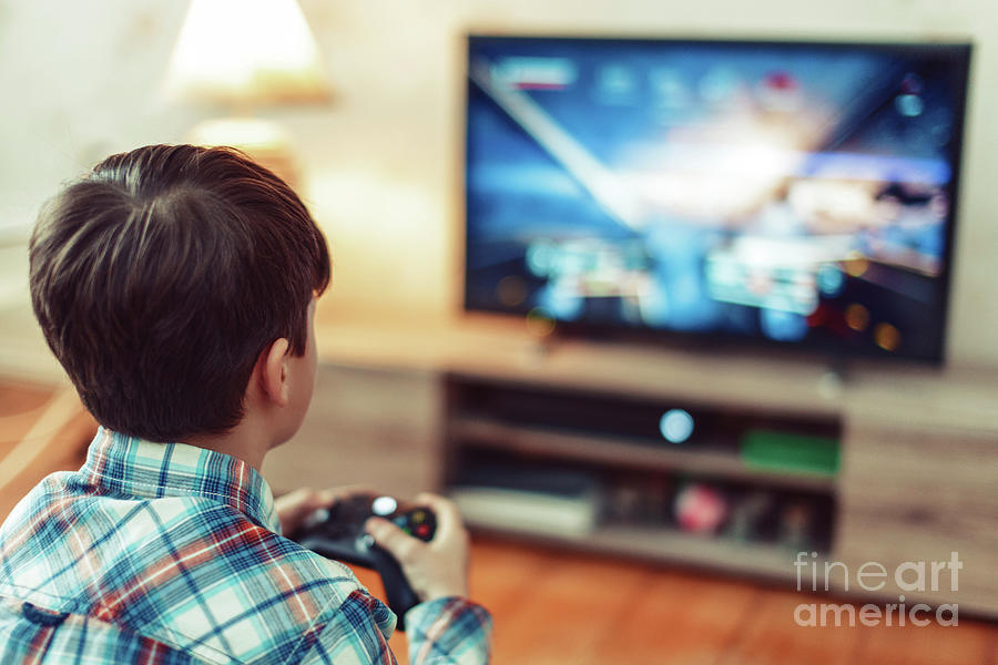 Young Boy Playing Video Game #11 Photograph by Sakkmesterke/science Photo Library