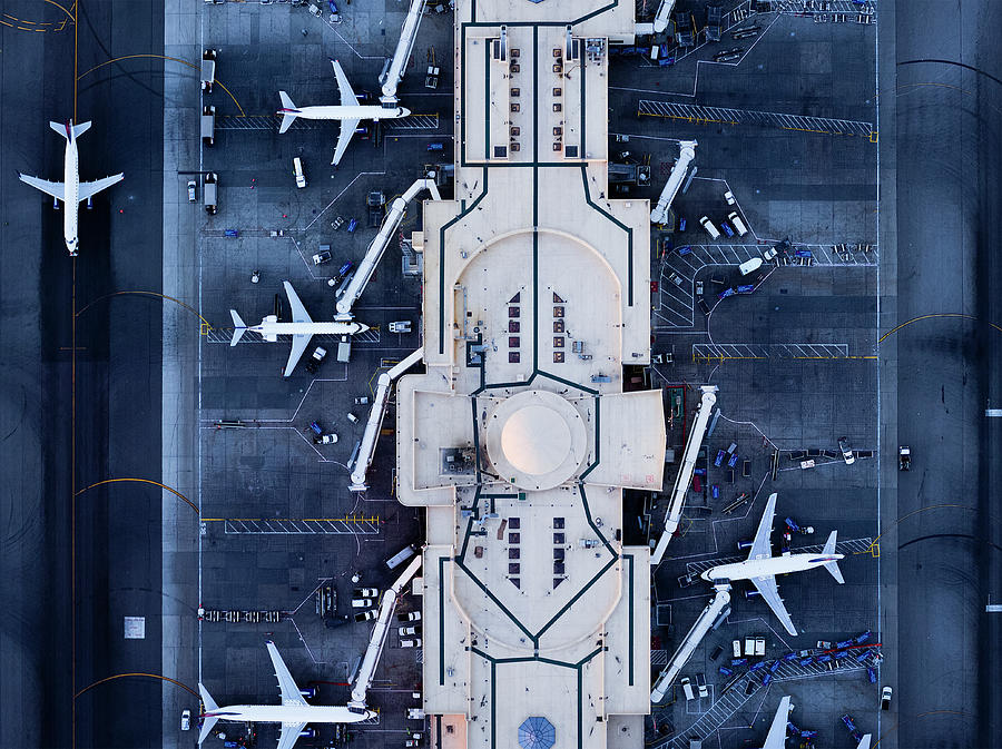 Airliners At  Gates And Control Tower Photograph by Michael H