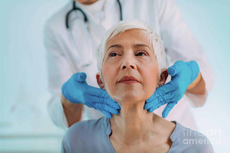 Doctor Examining A Senior Womans Neck #12 Photograph by Microgen Images/science Photo Library