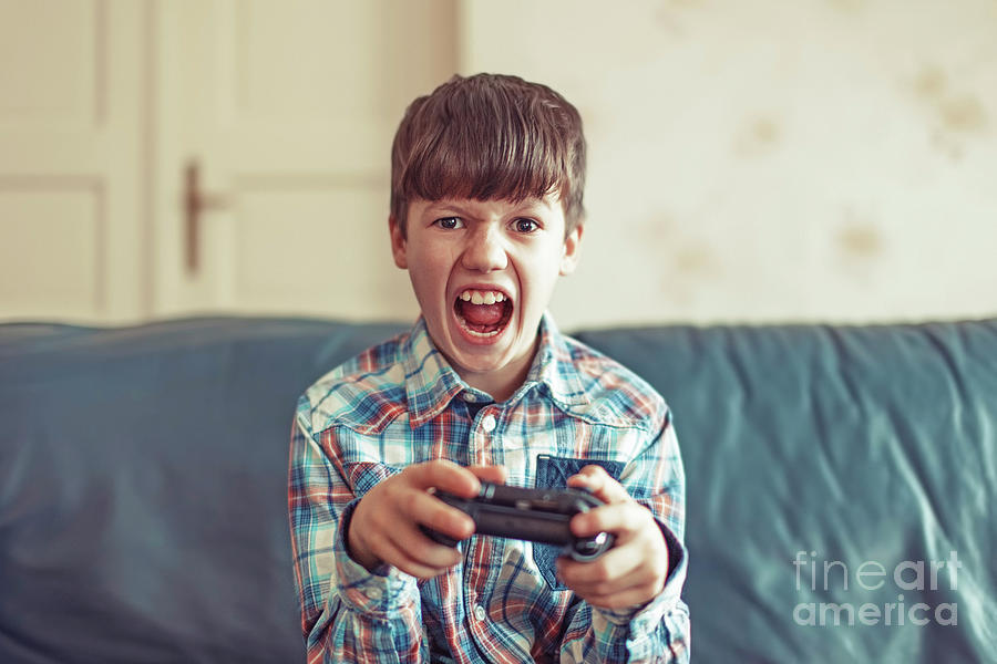 Young Boy Playing Video Game #12 Photograph by Sakkmesterke/science Photo Library