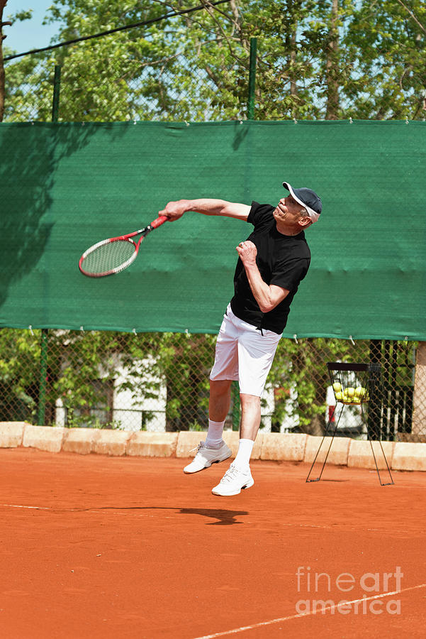 Active Senior Man Playing Tennis #16 Photograph by Microgen Images/science Photo Library