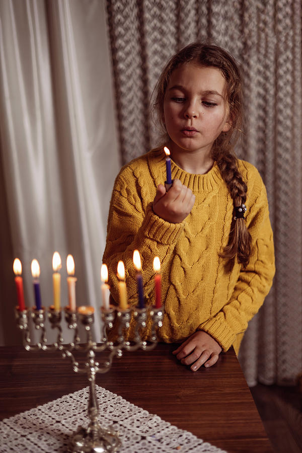 Family Celebration Of The Jewish Holiday Hanukkah At Home Photograph by