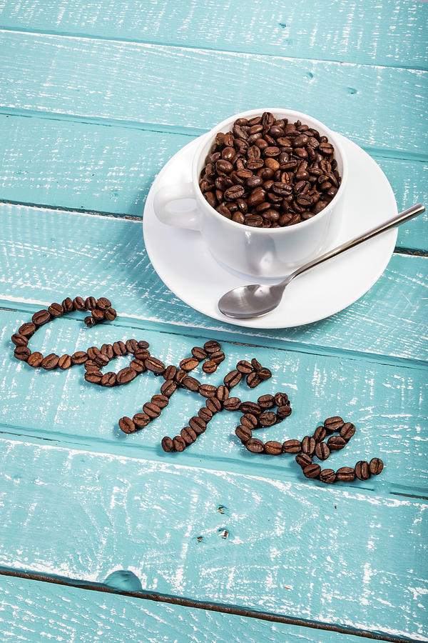 Coffee on a blue weathered table by Ben Gingell Coffee on a blue weathered table by Ben Gingell