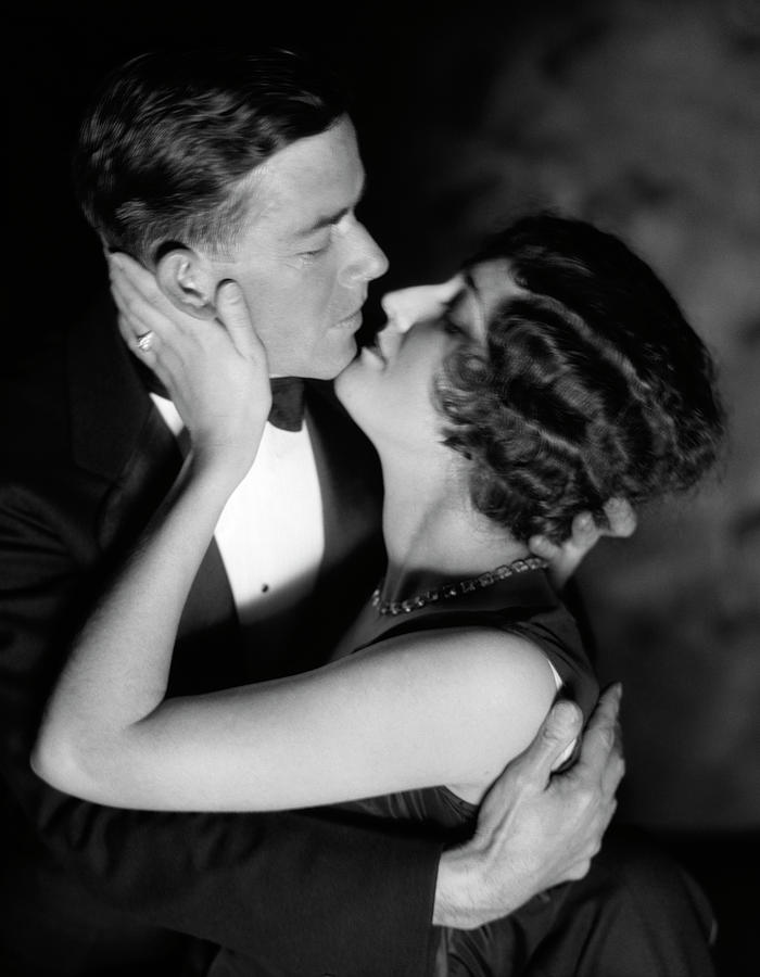 Black And White Photograph - 1920s 1930s Romantic Couple Embracing by Vintage Images