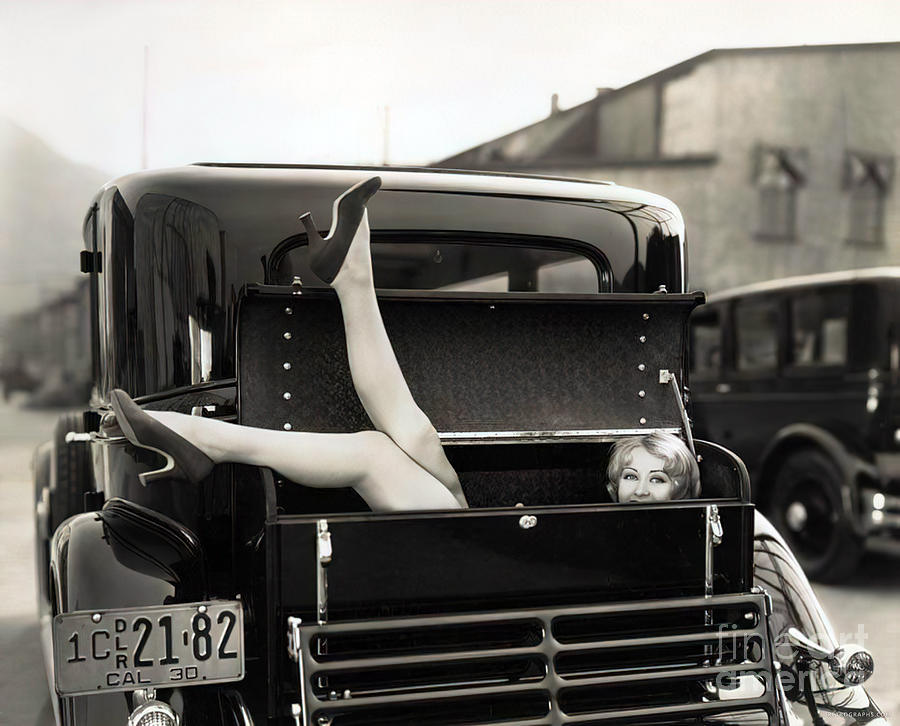 1930s Model With Feet Hanging Out Of Car Trunk Photograph by Retrographs