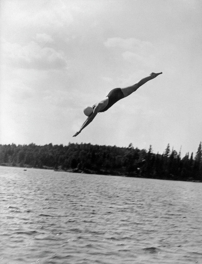 1930s Young Woman Diving Into Lake Painting by Vintage Images