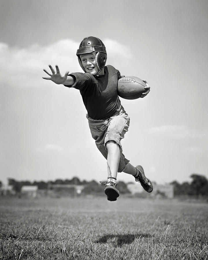 Black And White Painting - 1940s Boy Wearing Helmet Football by Vintage Images