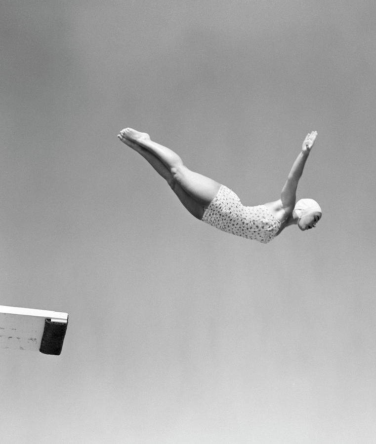 Black And White Painting - 1950s Woman Swan Dive Off Diving Board by Vintage Images