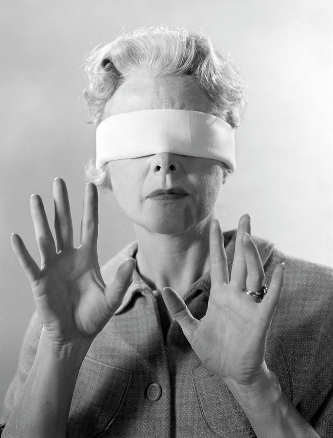 1960s Elderly Woman Wearing Blindfold by Vintage Images