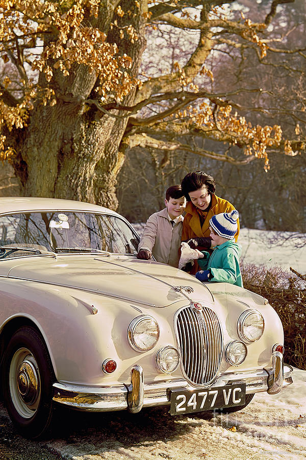 1965 Jaguar 3.8 Sedan With Family In Snowy Setting Photograph by Retrographs