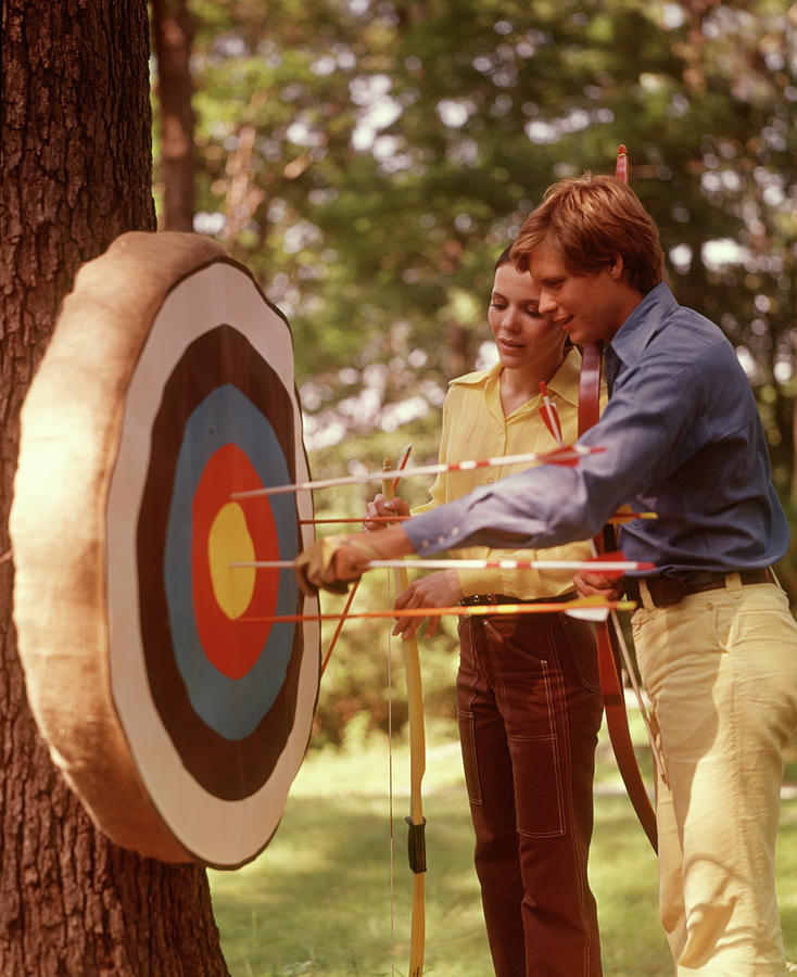 Sports Painting - 1970s Couple Archery Target Bows Arrows by Vintage Images
