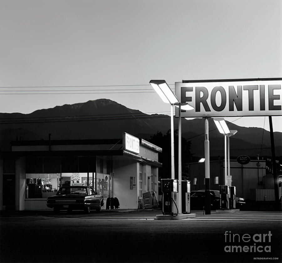 1970s Frontier Gas Station At Dusk Photograph by Retrographs