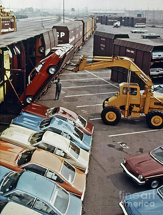 1970s Scene Of Chevrolet Vegas Getting Moved For Transport Photograph by Retrographs