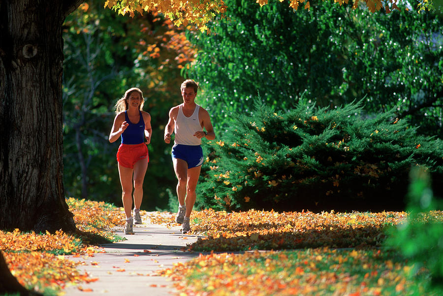 Sports Painting - 1990s Couple Jogging In Autumn by Vintage Images