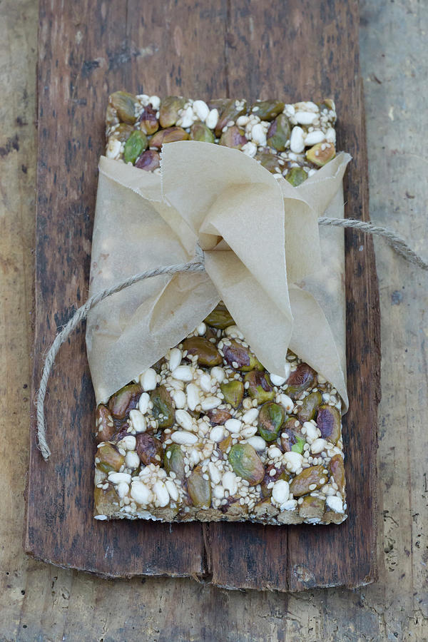 A Granola Bar With Pistachios, Sunflower Seeds And Sesame Seeds #2 Photograph by Martina Schindler