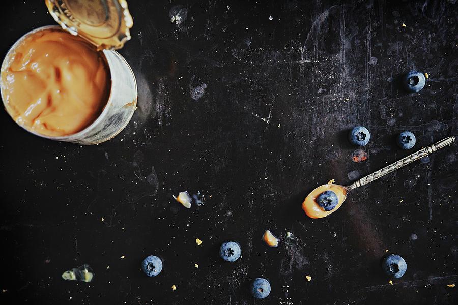 A Tin Of Dulce De Leche And Blueberries #2 Photograph by Fanny Rdvik