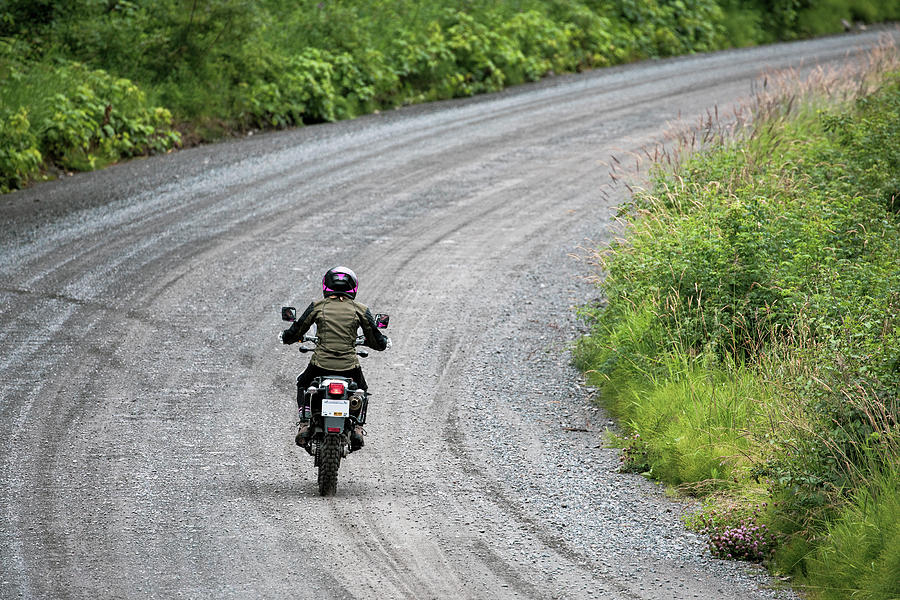 Boot Photograph - A Women Rides Her Motorcycle On A Gravel Road In Canada. #2 by Cavan Images