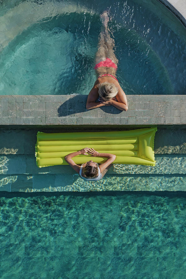 Aerial View Of Two Women In Pool Photograph by Cavan Images ...