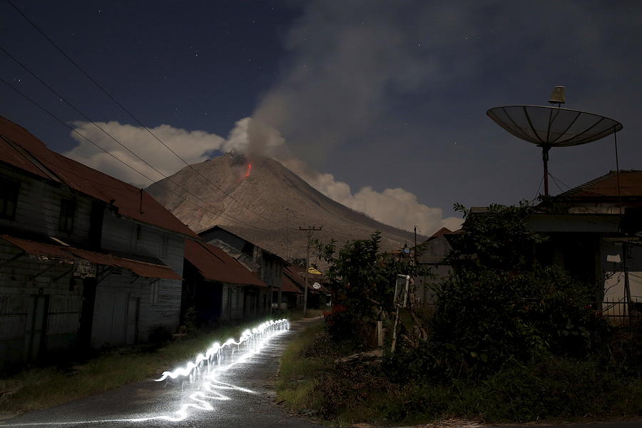 Ash Spews from Mount Sinabung Volcano Photograph by Beawiharta ...