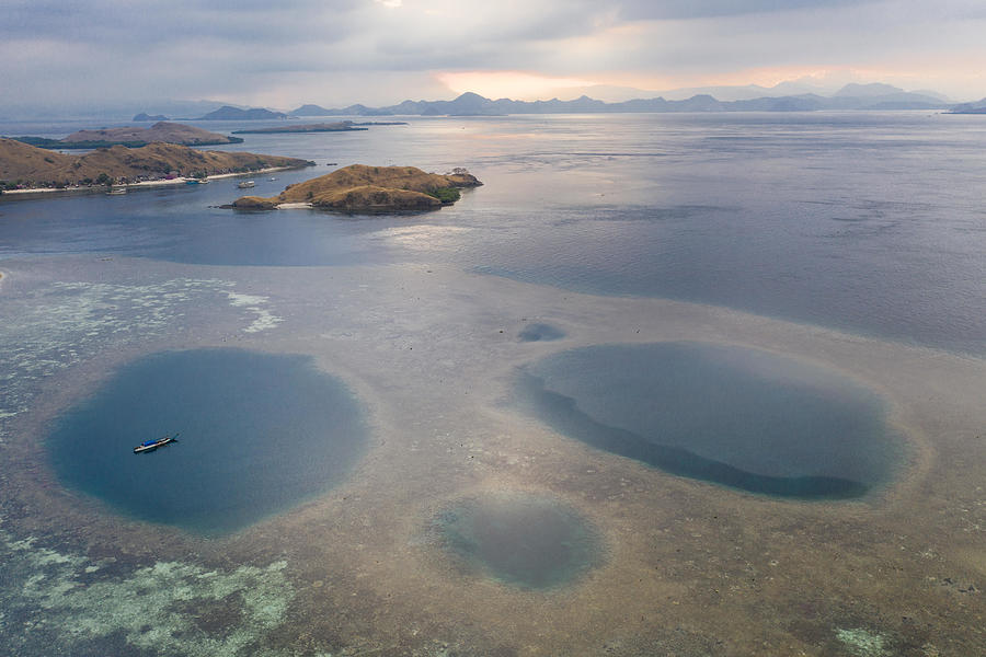 Komodo National Park Photograph - Blue Holes Are Found Amid A Shallow #2 by Ethan Daniels