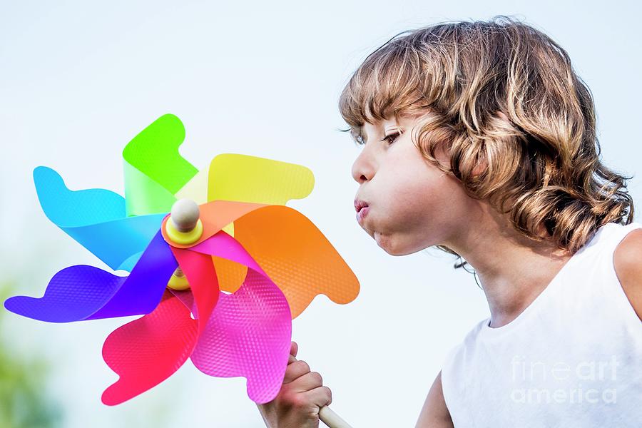 Boy Blowing Paper Windmill Photograph by Science Photo Library - Fine ...