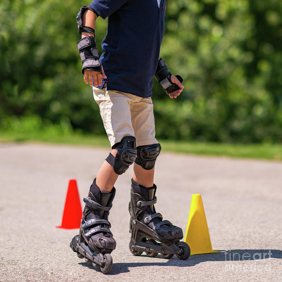Summer Photograph - Boy Learning To Roller Skate #2 by Microgen Images/science Photo Library