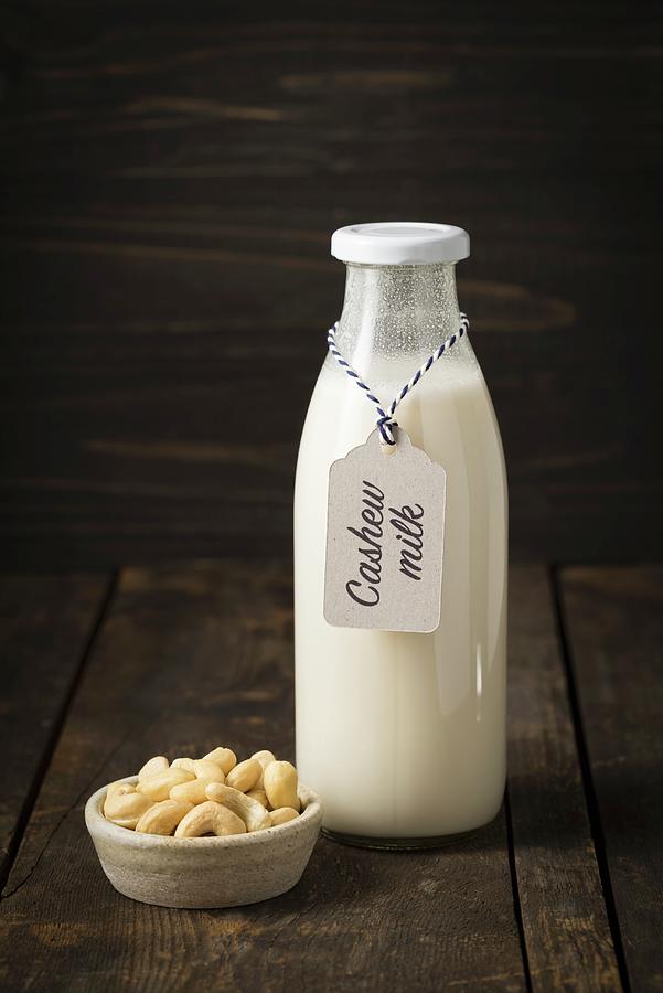 Cashew Nut Milk In A Glass Bottle #2 Photograph by Elisabeth Clfen