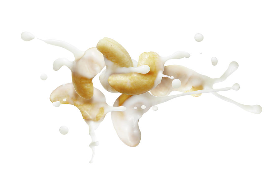 Cashews With A Milk Splash #2 Photograph by Krger & Gross