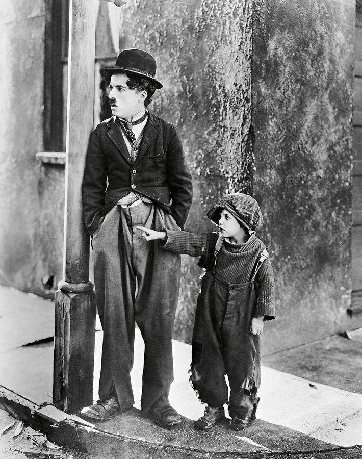 CHARLIE CHAPLIN and JACKIE COOGAN in THE KID -1921-. #2 Photograph by Album