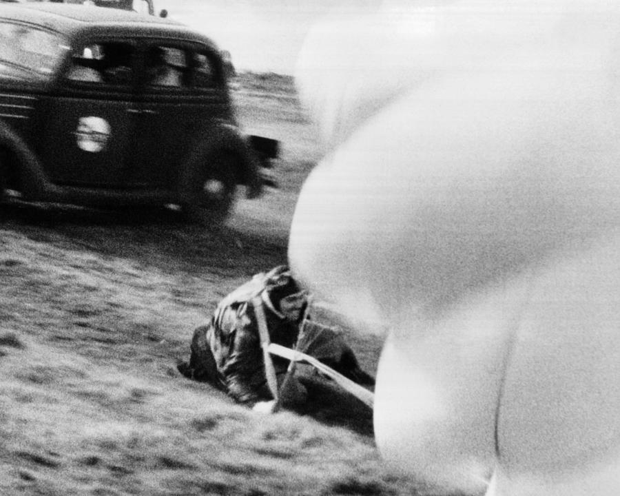 Transportation Photograph - Clark Glabe Landing On Landscape With Parachute #2 by Globe Photos